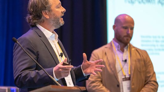 2 male speakers on stage