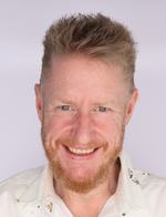Headshot of a man in business attire