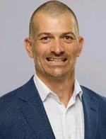 Headshot of a man in business attire
