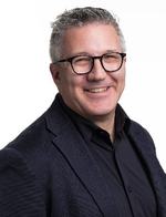 Headshot of a man in business attire