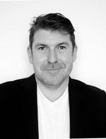 Headshot of a man in business attire
