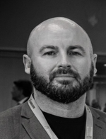 Headshot of a man in business attire